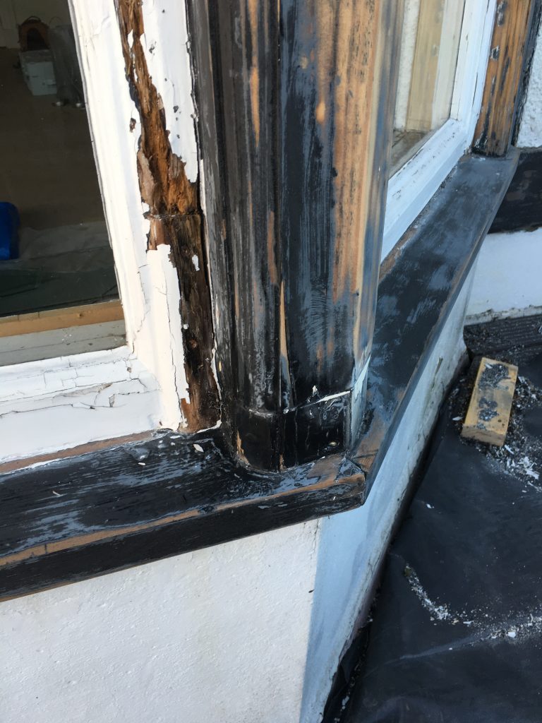 Rotten timber on the frame of an old sash window