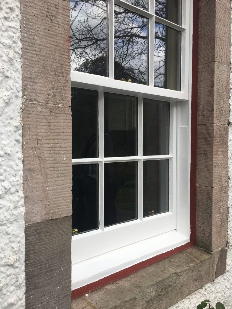 Restored timber sash and case window with draught proofing