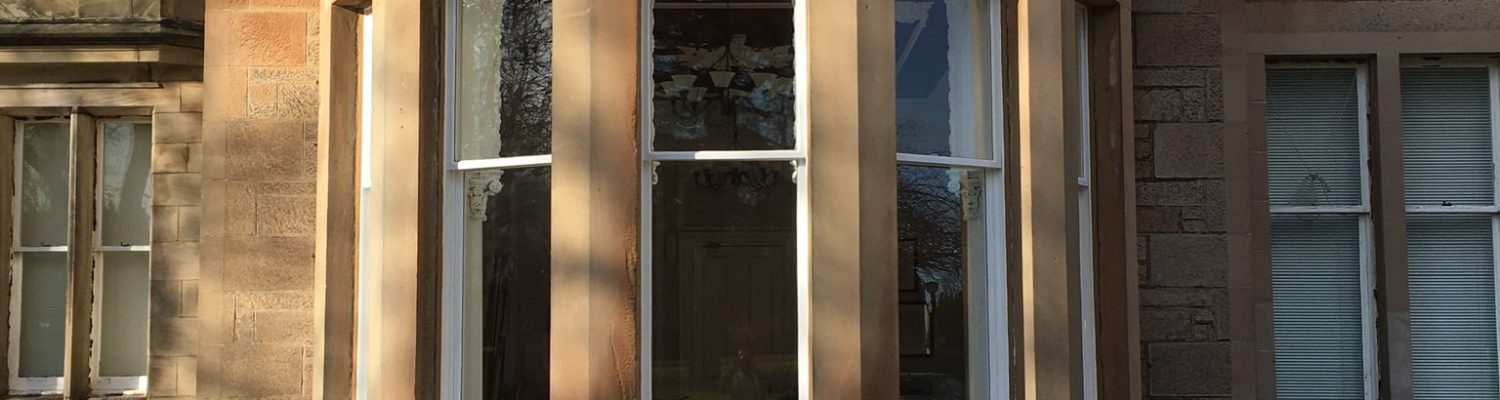 Period stone property with traditional sash windows in Edinburgh